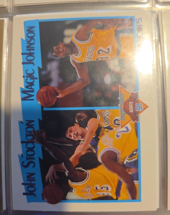 1991-92 NBA Hoops #312 John Stockton / Magic Johnson League Leaders Assists — front