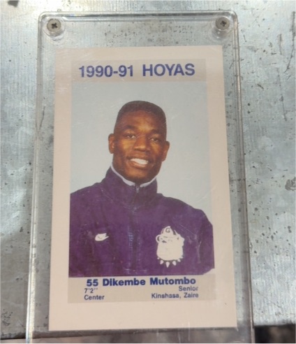 1990-91 Coca-Cola Police #55 Dikembe Mutombo — front