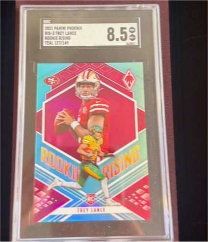 2021 Panini Phoenix #RIS-3 Trey Lance Rookie Rising Teal — front