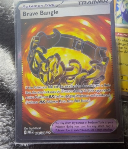 2026 Pokémon TCG #104/084 Brave Bangle — front