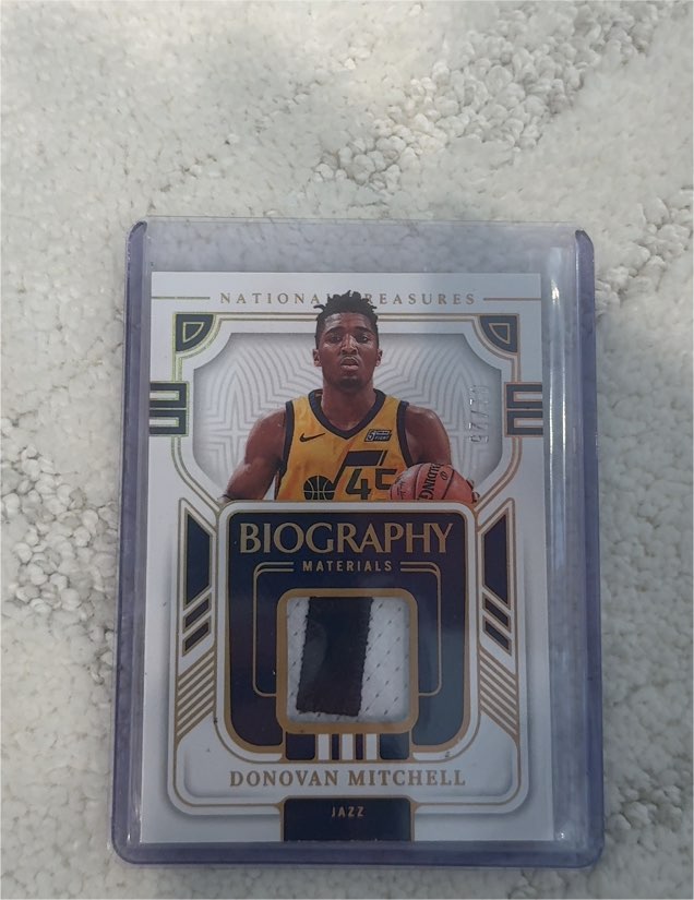 2022 Panini National Treasures Biography Materials #/25 Donovan Mitchell — front