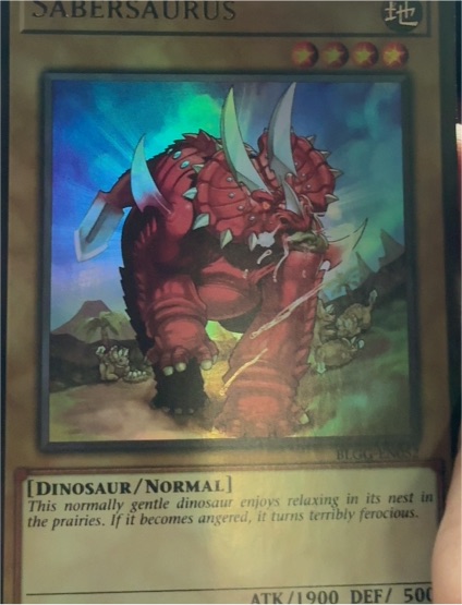 Yu-Gi-Oh! 2021 Battles of Legend: Glorious Gallery #BLGG-EN052 Sabersaurus — front