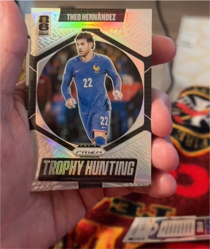 2026 Panini Prizm World Cup #22 Theo Hernandez Trophy Hunting Silver — front