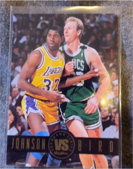 1993-94 Skybox Premium Showdown Series #SS12 Magic Johnson vs Larry Bird — front