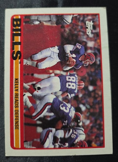 1989 Topps #40 Buffalo Bills Team Leaders (Kelly Reads Defense) Jim Kelly — front
