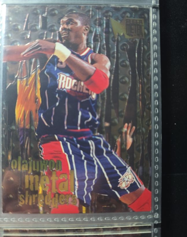 1996-97 Fleer Metal #142 Hakeem Olajuwon Metal Shredders Houston Rockets — front