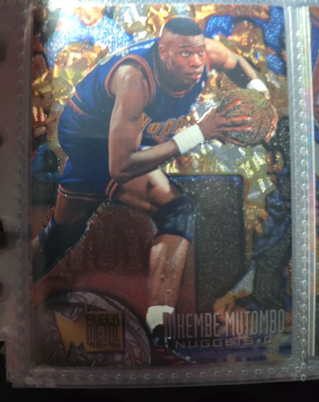 1995-96 Fleer Metal #25 Dikembe Mutombo — front