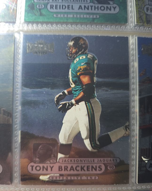 1998 Skybox Metal Universe #99 Tony Brackens — front