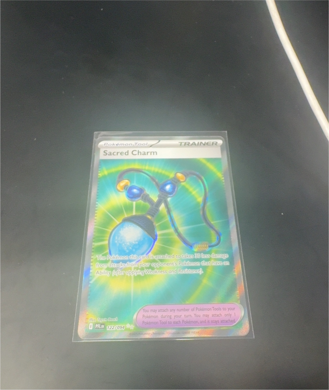 2025 Pokémon #122 Sacred Charm — front