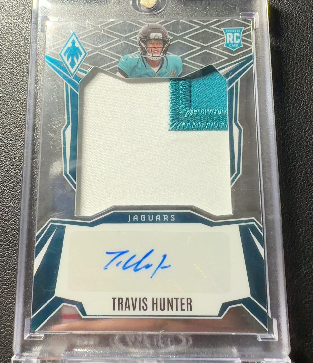 2025 Panini Absolute Rookie Premiere Materials Autographs Travis Hunter — front