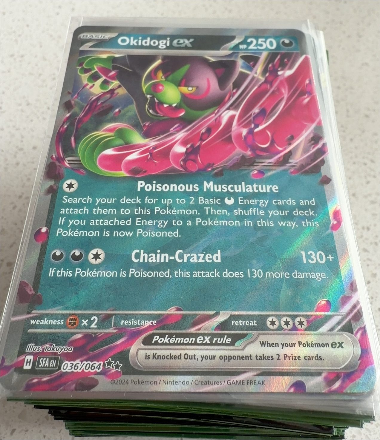 2024 Pokémon TCG 036 Okidogi ex — front