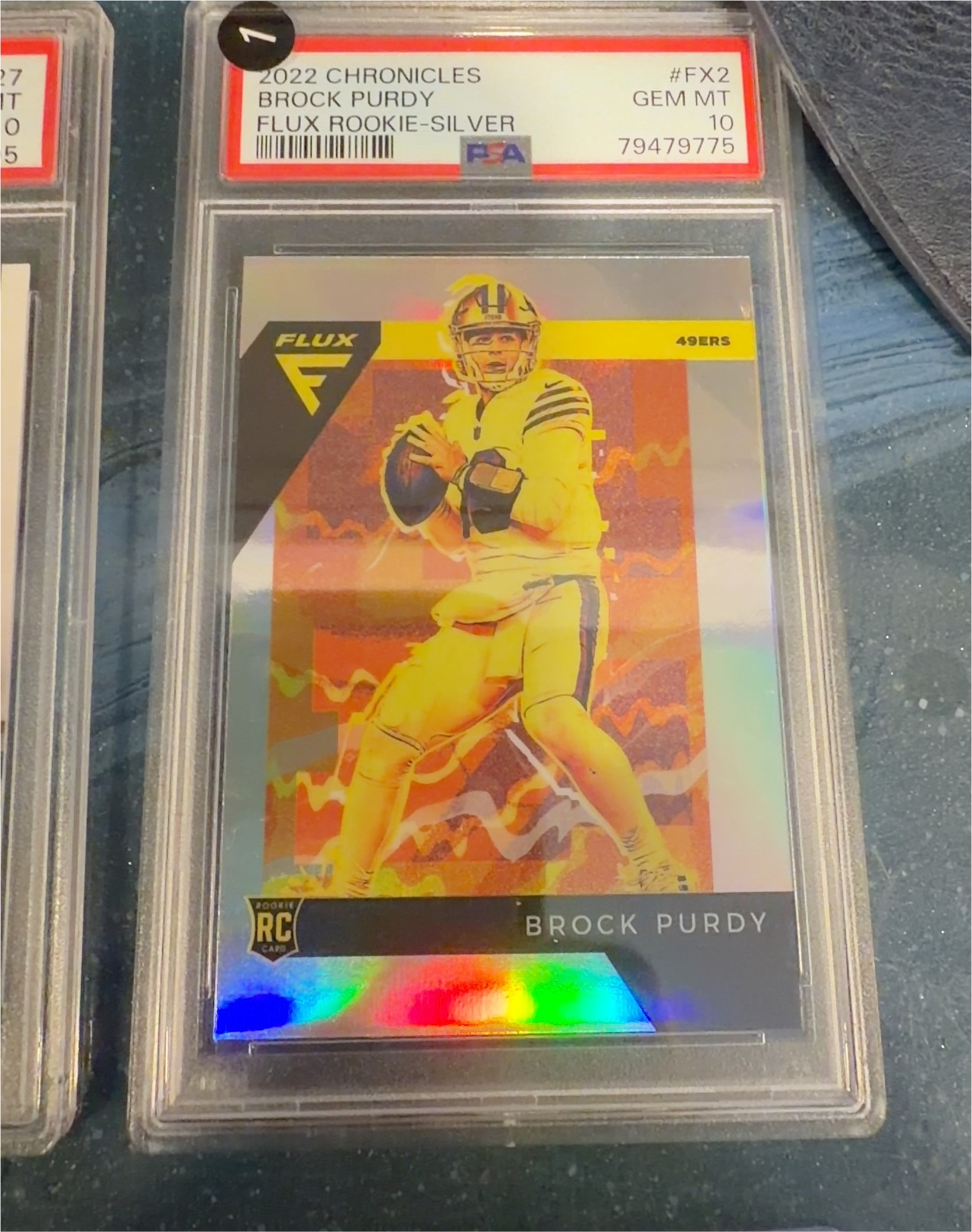 2022 Panini Chronicles Flux Rookies #FX-2 Brock Purdy — front